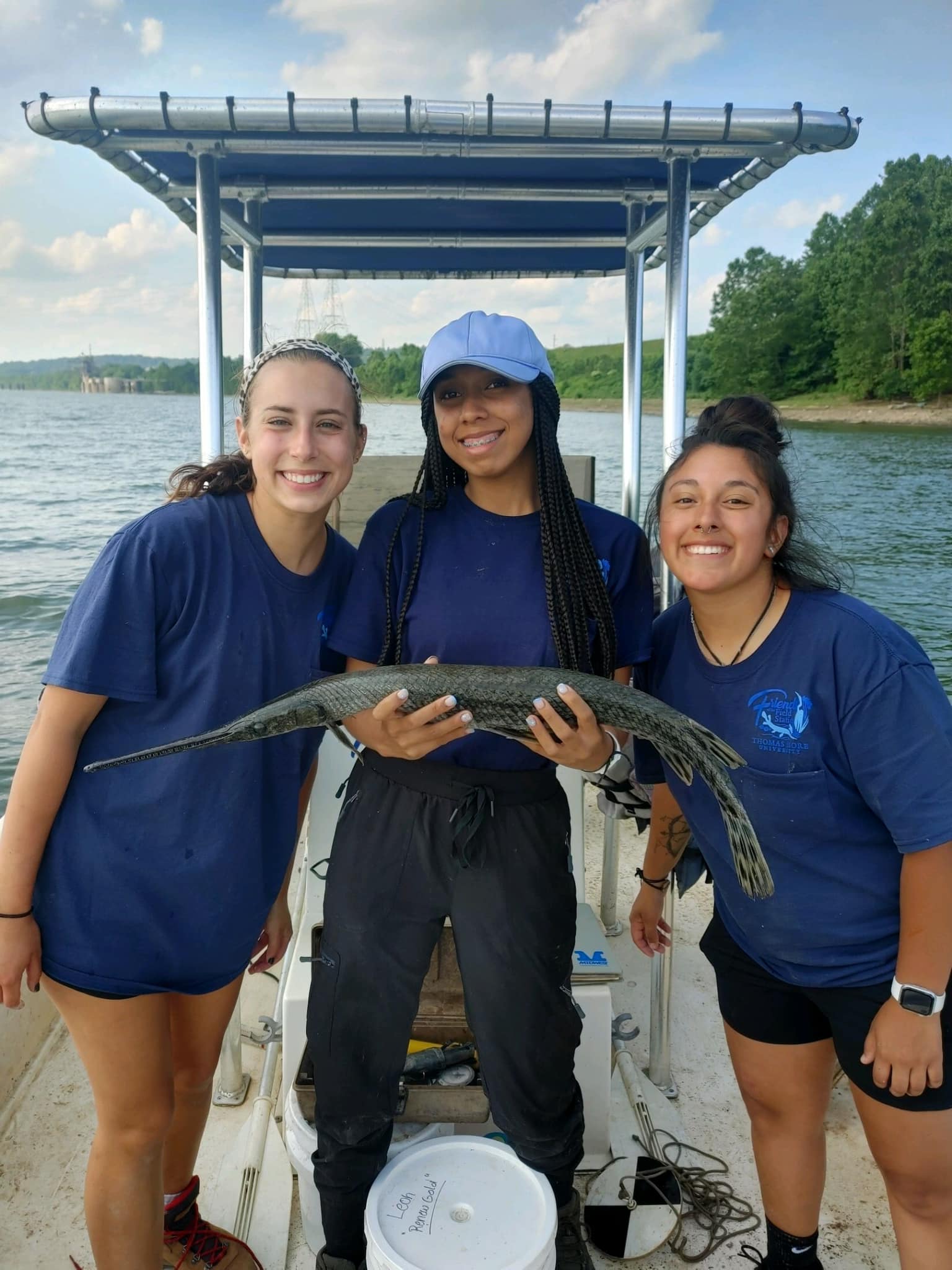 Thomas More U Biology Field station student researchers on a boat on the Ohio River